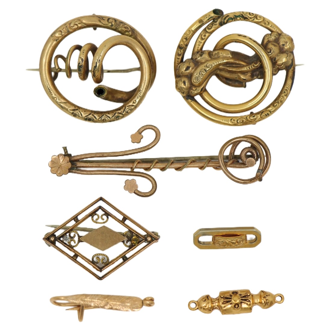 A Lot of Seven Antique Gold Filled Brooch & Charms: A Lot of Seven Antique Gold Filled Brooch & Charms Approximate Dimensions: 1.5 cm - 5.5 cm (Length) 0.6 cm - 3 cm (Width) 21.6 grams in total weight.