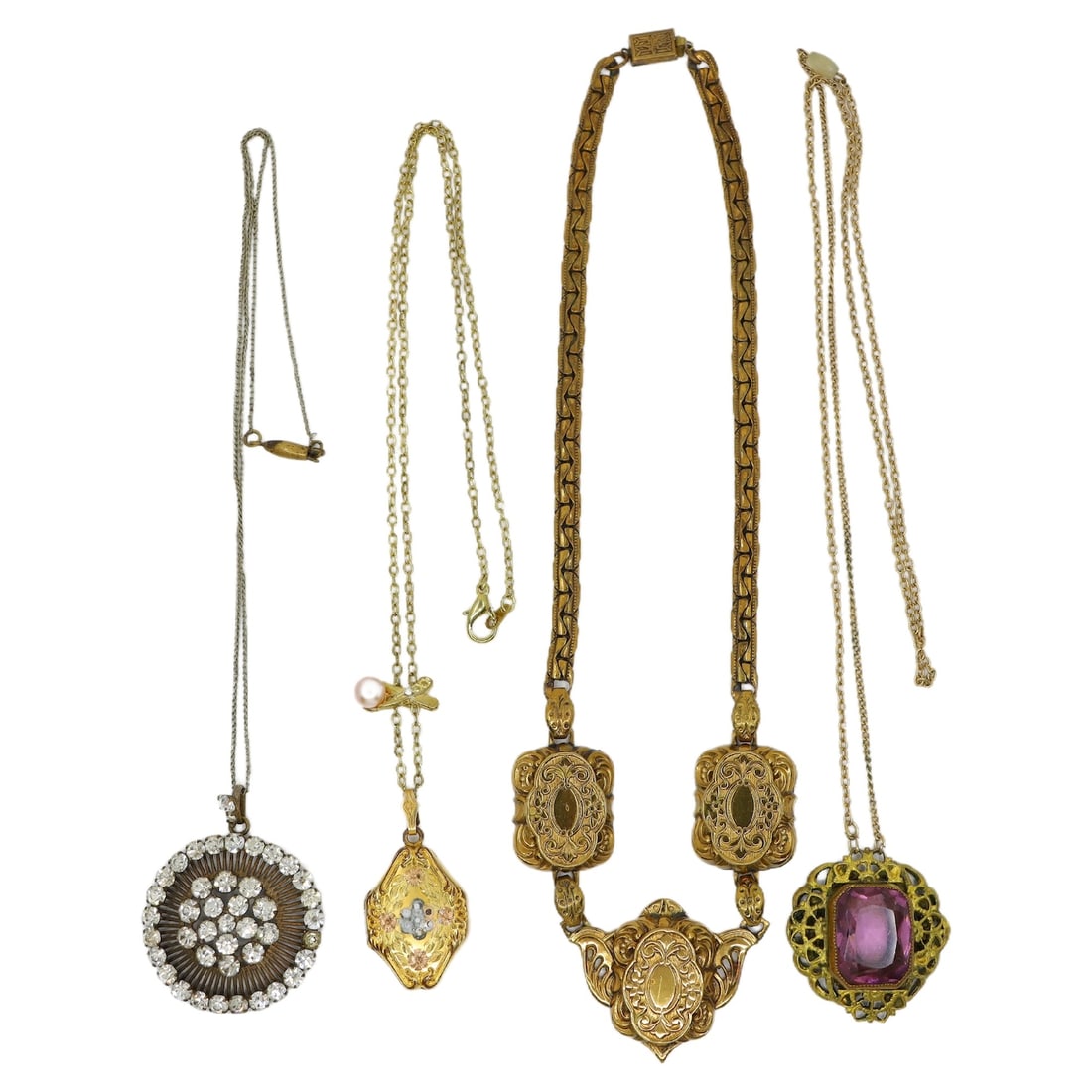 A Lot of Four Gold Filled Amethyst Rhinestone Locket Necklaces: A Lot of Four Gold Filled Amethyst Rhinestone Locket Necklaces Approximate Dimensions: 40 cm - 59 cm (Length) 3 cm - 4.2 cm (Pendant Length) 2 cm - 3.8 cm (Pendant Width) 70.3 grams in total weight.