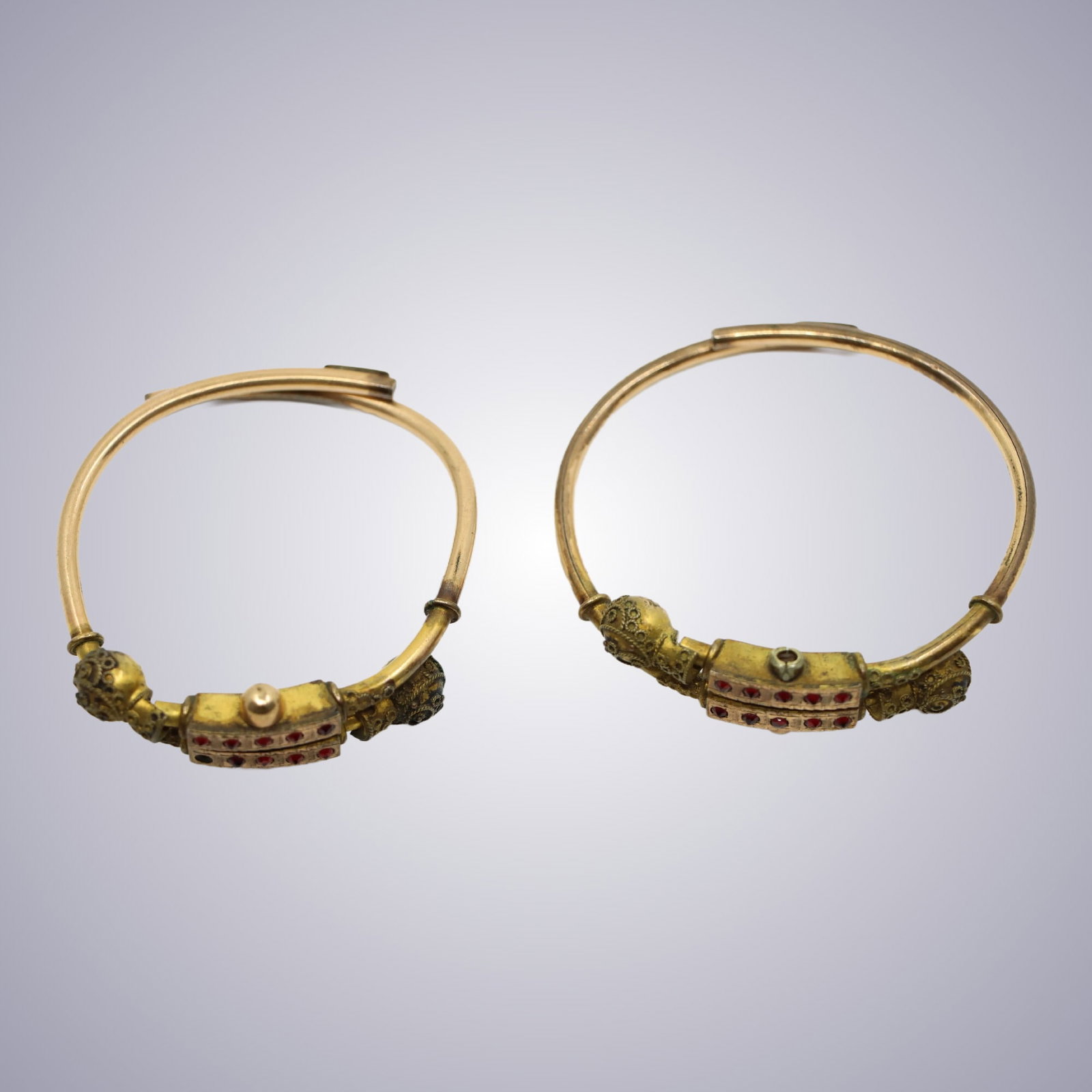 A Pair Of Gold Filled Garnet Bracelets: A Pair Of Gold Filled Garnet Bracelets Approximate Dimensions: 6- 6.25 inches(Length) 0.15 - 0.75 inches (Width) 31.5 grams in weight 15.25 - 15.9 x 0.38 - 1.9 cm)
