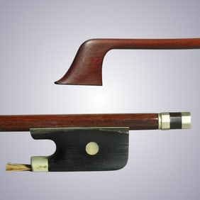 AN UNSTAMPED CELLO BOW WITH OLD TARISIO LABEL