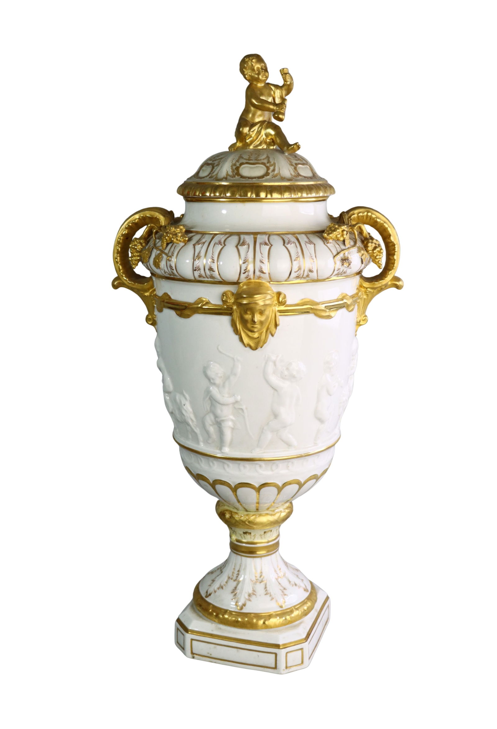 19TH CENTURY KPM COVERED URN AMPHORA PORCELAIN VASE: 19TH CENTURY KPM BERLIN COVERED URN AMPHORA PORCELAIN VASE A tall KPM Berlin porcelain urn with domed cover surmounted by a gilt putto figure. The body is decorated with molded relief of frolicking ch