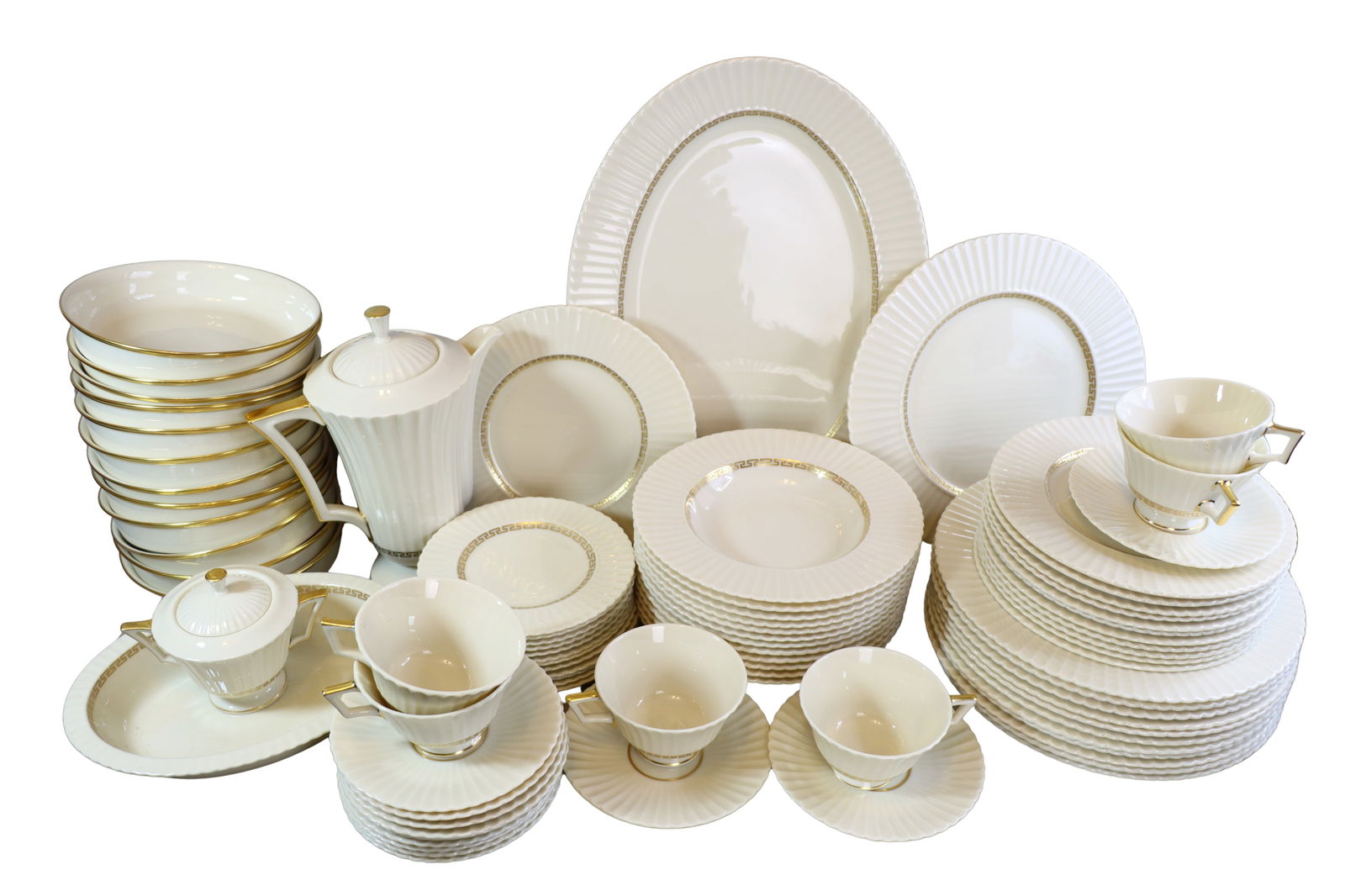 LENOX CRETAN GREEK KEY GILT TRIM PORCELAIN PLATE SETTINGS: LENOX CRETAN GREEK KEY GILT TRIM PORCELAIN PLATE SETTINGS The Set is comprised of approximately: (6) Tea Cups (12) Saucers (12) Bread Plates (12) Salad Plates (12) Soup Plates (12) Dinner Plates (12)