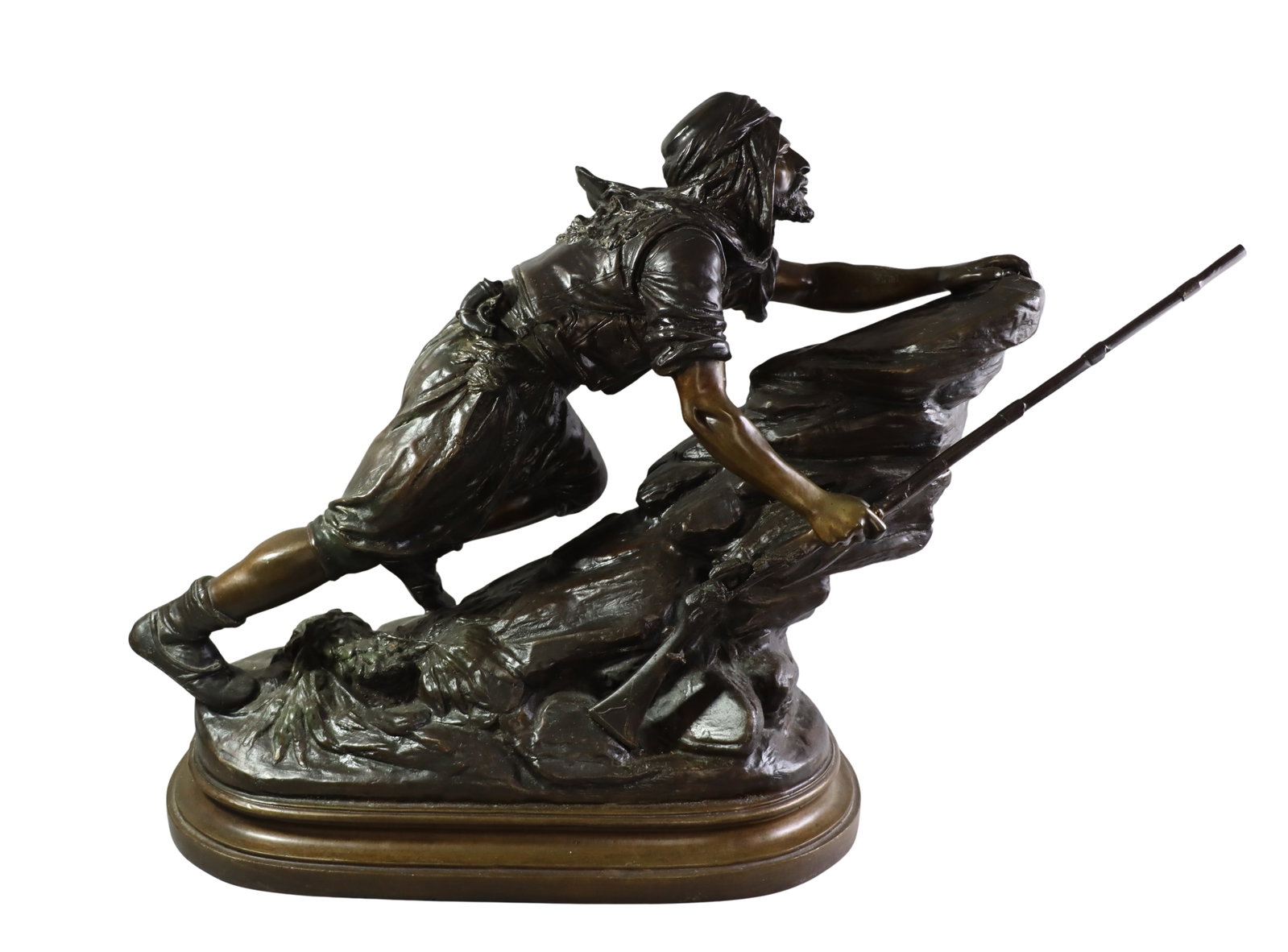 ORIENTALIST BRONZE SCULPTURE OF ARABIC WARRIOR: ORIENTALIST BRONZE SCULPTURE OF ARABIC WARRIOR An impressive Orientalist bronze sculpture, depicting an Arabic warrior climbing a rocky slope with rifle in hand. The figure is dressed in traditional a