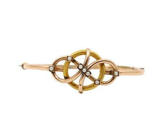 A VICTORIAN 14KT GOLD SEED PEARL BANGLE