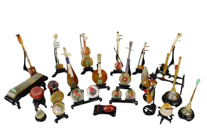 A CHINESE SET OF 24 MINIATURE AGATE & HARDSTONE CARVED MUSICAL INSTRUMENTS WITH BOX