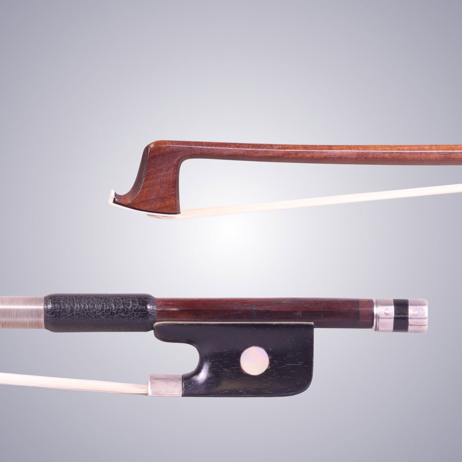 A SILVER VIOLA BOW BY LOUIS PANORMO: A SILVER VIOLA BOW BY LOUIS PANORMO Of Octagonal Pernambuco Stick (Nicely figured), Ebony & Silver mounted. Stamped on stick above frog: L. PANORMO Approximate Dimensions: 73.8 cm (Total Length -