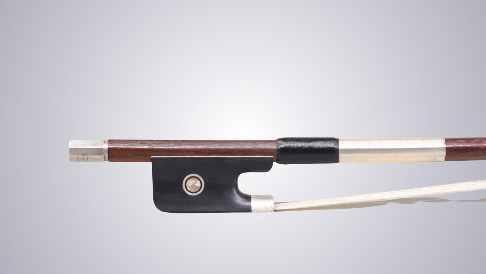 A SILVER MOUNTED CELLO BOW STAMPED P.C. - 8