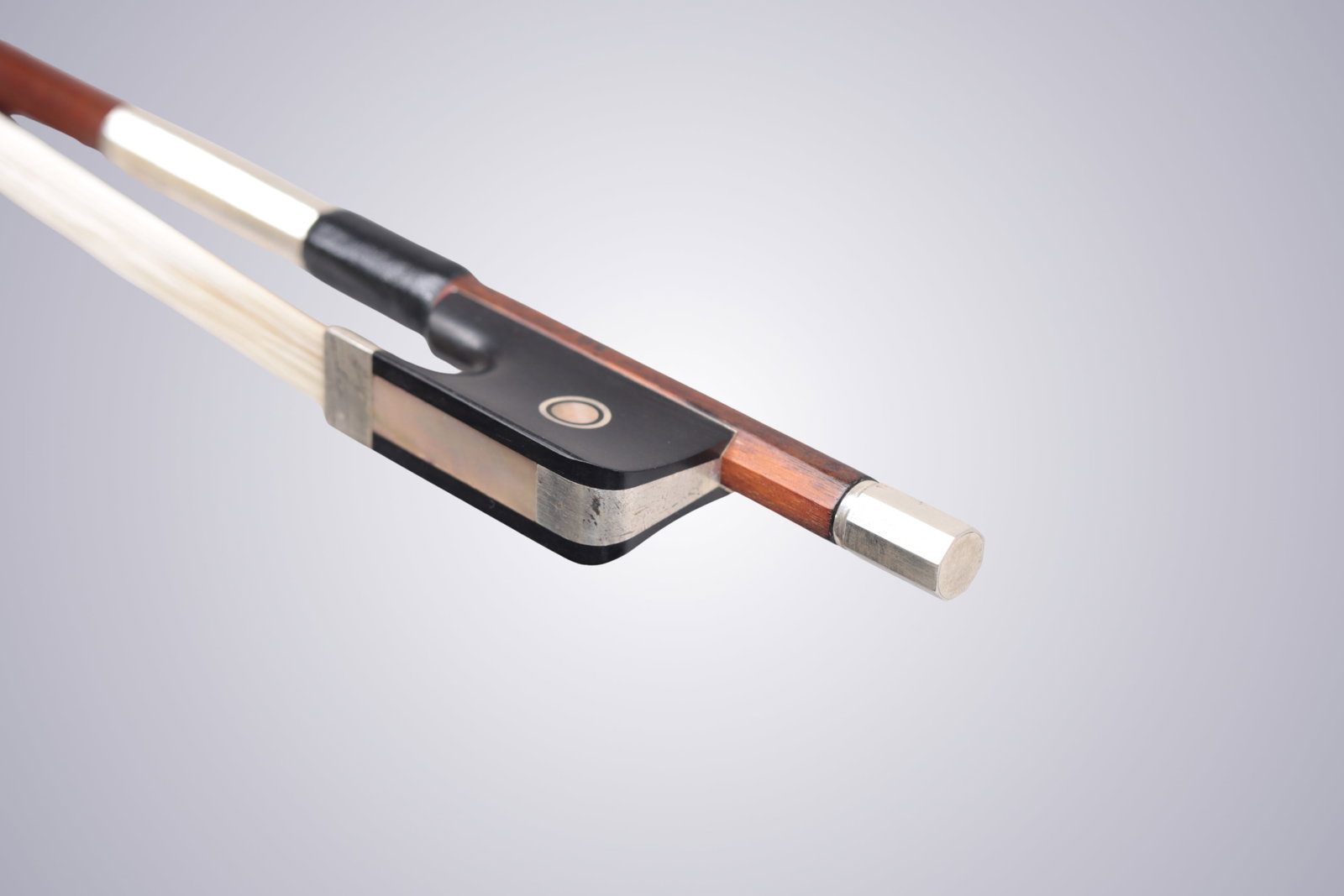 A SILVER MOUNTED CELLO BOW STAMPED P.C. - 9