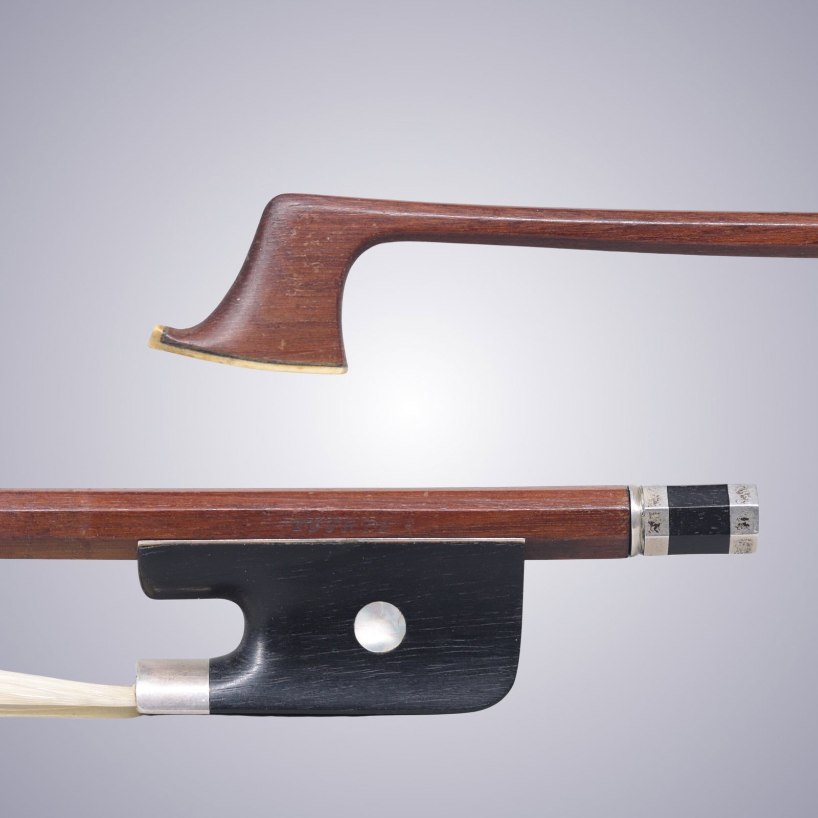 A SILVER MOUNTED CELLO BOW STAMPED TOURTE: A SILVER MOUNTED CELLO BOW STAMPED TOURTE Of Very Strong, Octagonal Stick, Ebony & Silver mounted. Stamped on stick above frog: TOURTE Approximate Dimensions: 71.6 cm (Total Length - Head to