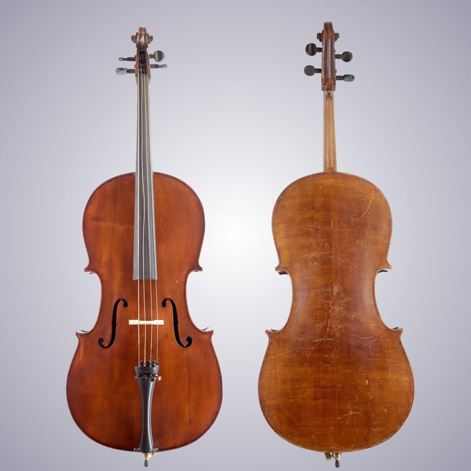 AN EASTERN EUROPEAN CELLO CIRCA 1940: AN EASTERN EUROPEAN CELLO CIRCA 1940 The back is of Two-piece, quarter-cut Maple with flame running horizontally from center. The scroll is of plainer wood. The ribs appear to be of slab-cut plain
