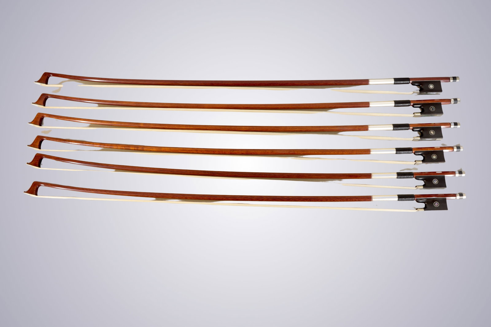 A LOT OF SIX FRACTIONAL 3/4 VIOLIN BOWS: A LOT OF SIX FRACTIONAL 3/4 VIOLIN BOWS Of Octagonal Stick, Ebony & Nickel mounted. Approximate Dimensions: 69.1 cm (Total Length - Head to Adjustor) 54.4 - 60.9 grams in weight