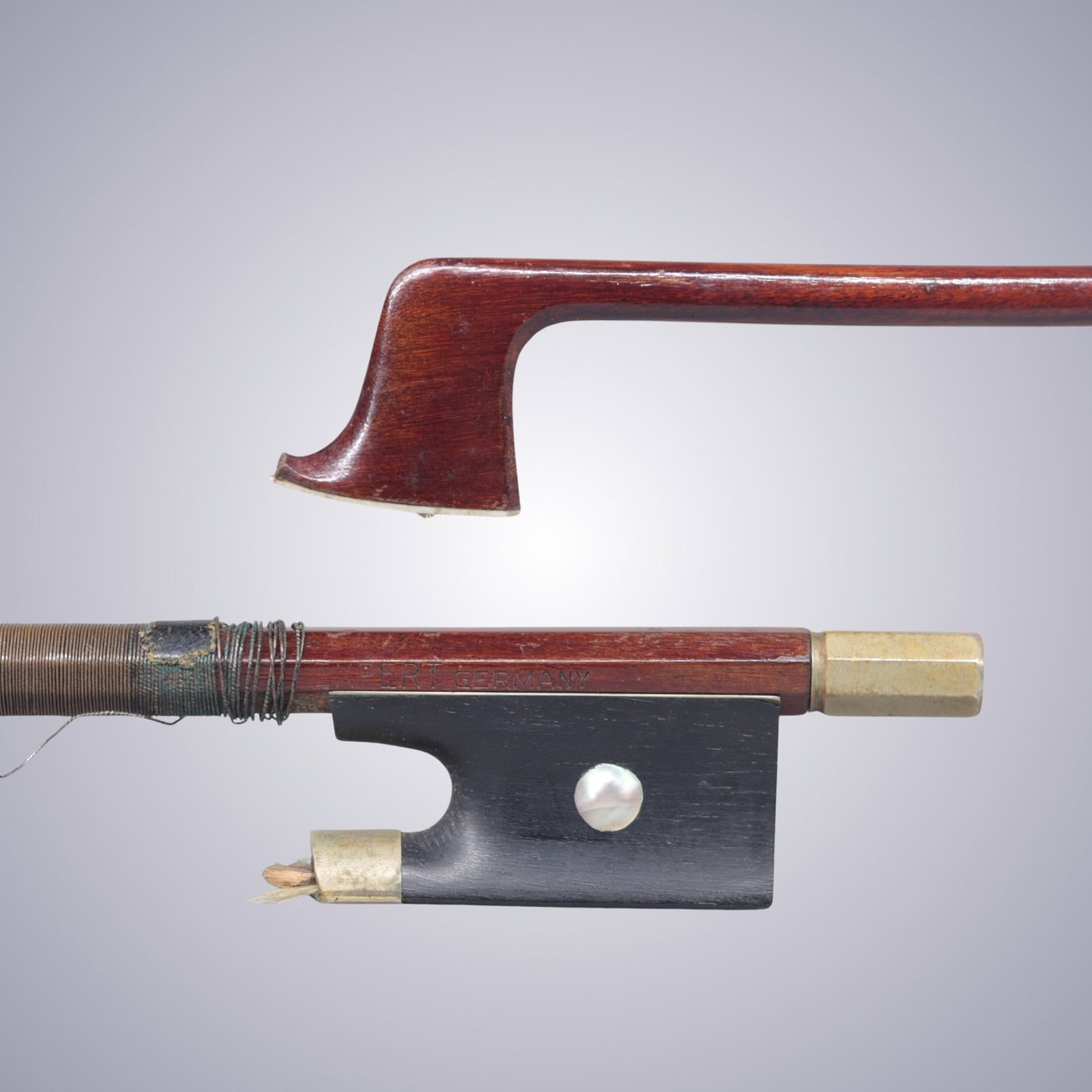 A VIOLIN BOW STAMPED XPERT GERMANY: A VIOLIN BOW STAMPED XPERT GERMANY Of Round Stick, Ebony & Nickel mounted. Stamped on stick above frog: XPERT GERMANY Approximate Dimensions: 74 cm (Total Length - Head to Adjustor) 50.7 grams in