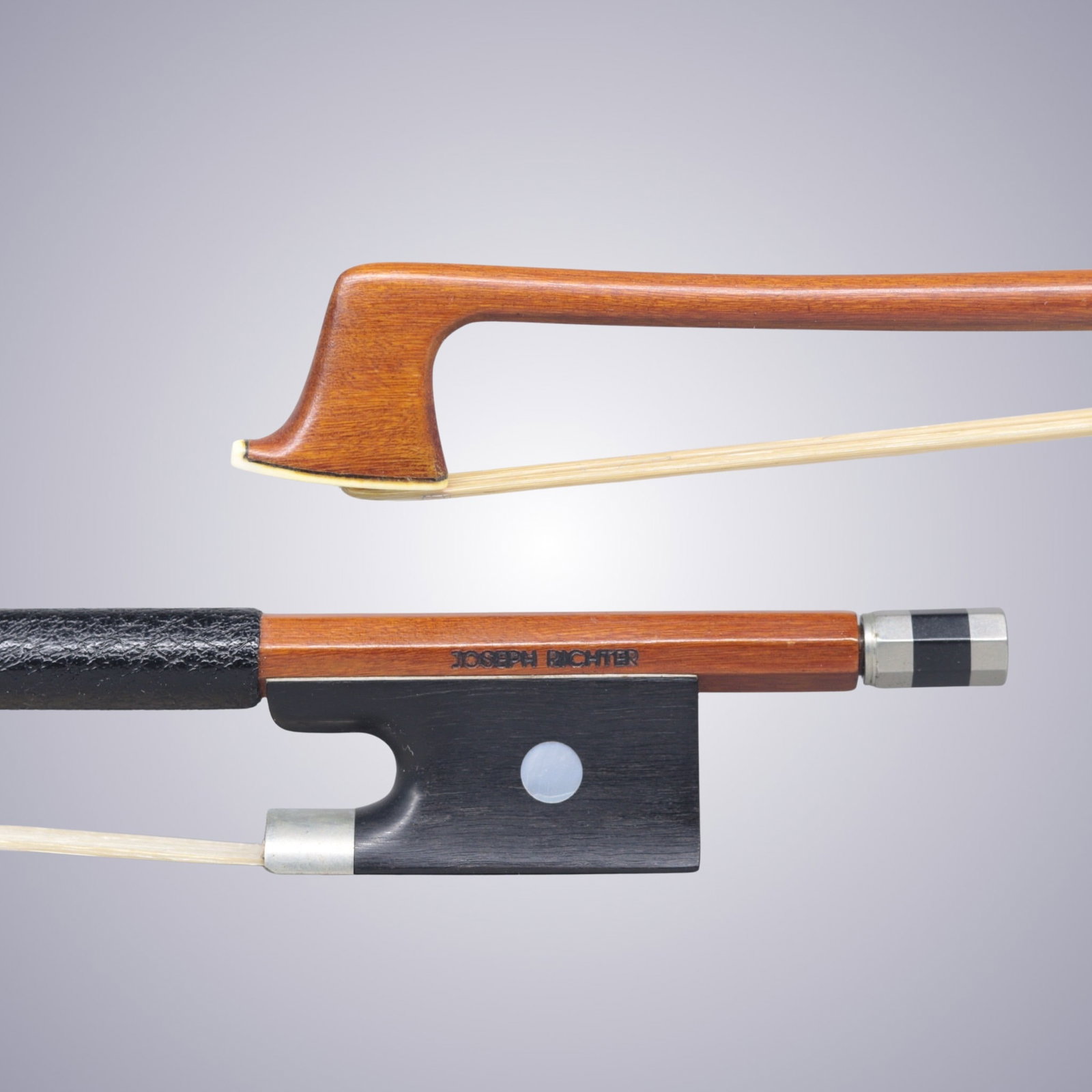 A VIOLIN BOW STAMPED JOSEPH RICHTER: A VIOLIN BOW STAMPED JOSEPH RICHTER Of Round Pernambuco Stick, Ebony & Nickel mounted. Stamped on stick above frog: JOSEPH RICHTER Approximate Dimensions: 74 cm (Total Length - Head to Adjustor) 62.7