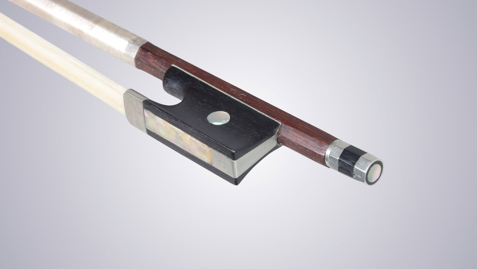 A VIOLIN BOW STAMPED P.C. - 10