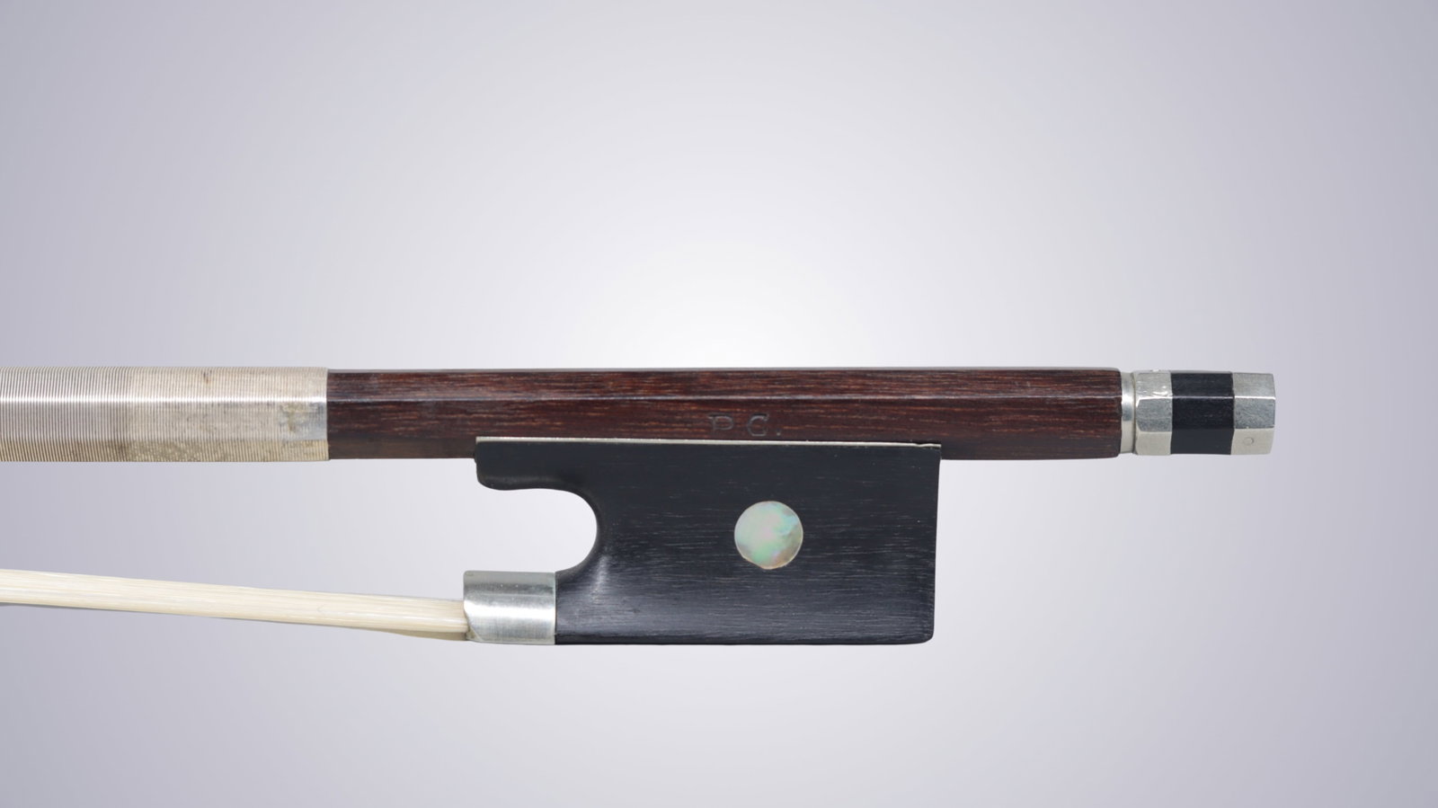 A VIOLIN BOW STAMPED P.C. - 2