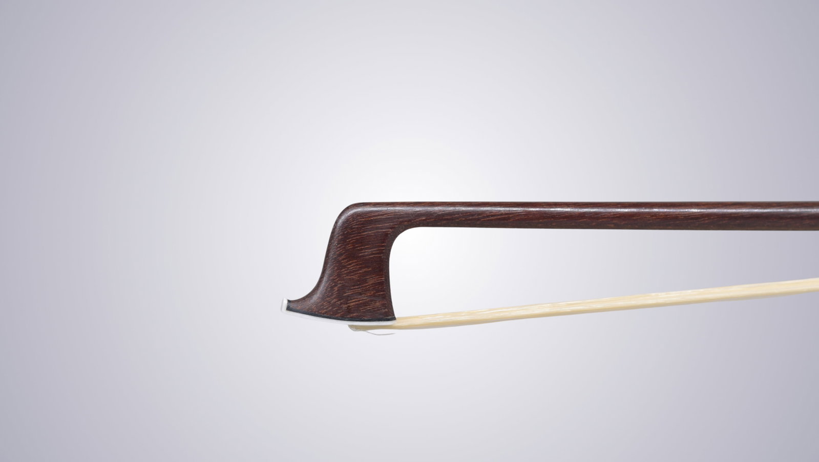 A VIOLIN BOW STAMPED P.C. - 3