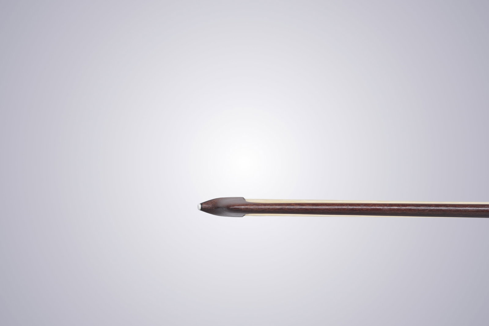 A VIOLIN BOW STAMPED P.C. - 4