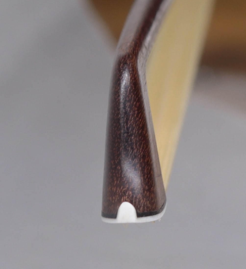 A VIOLIN BOW STAMPED P.C. - 5