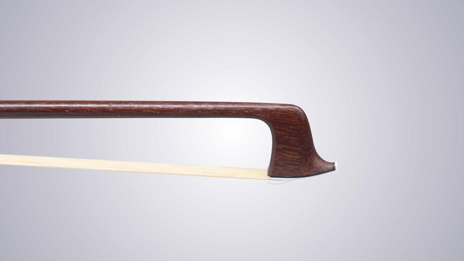 A VIOLIN BOW STAMPED P.C. - 6