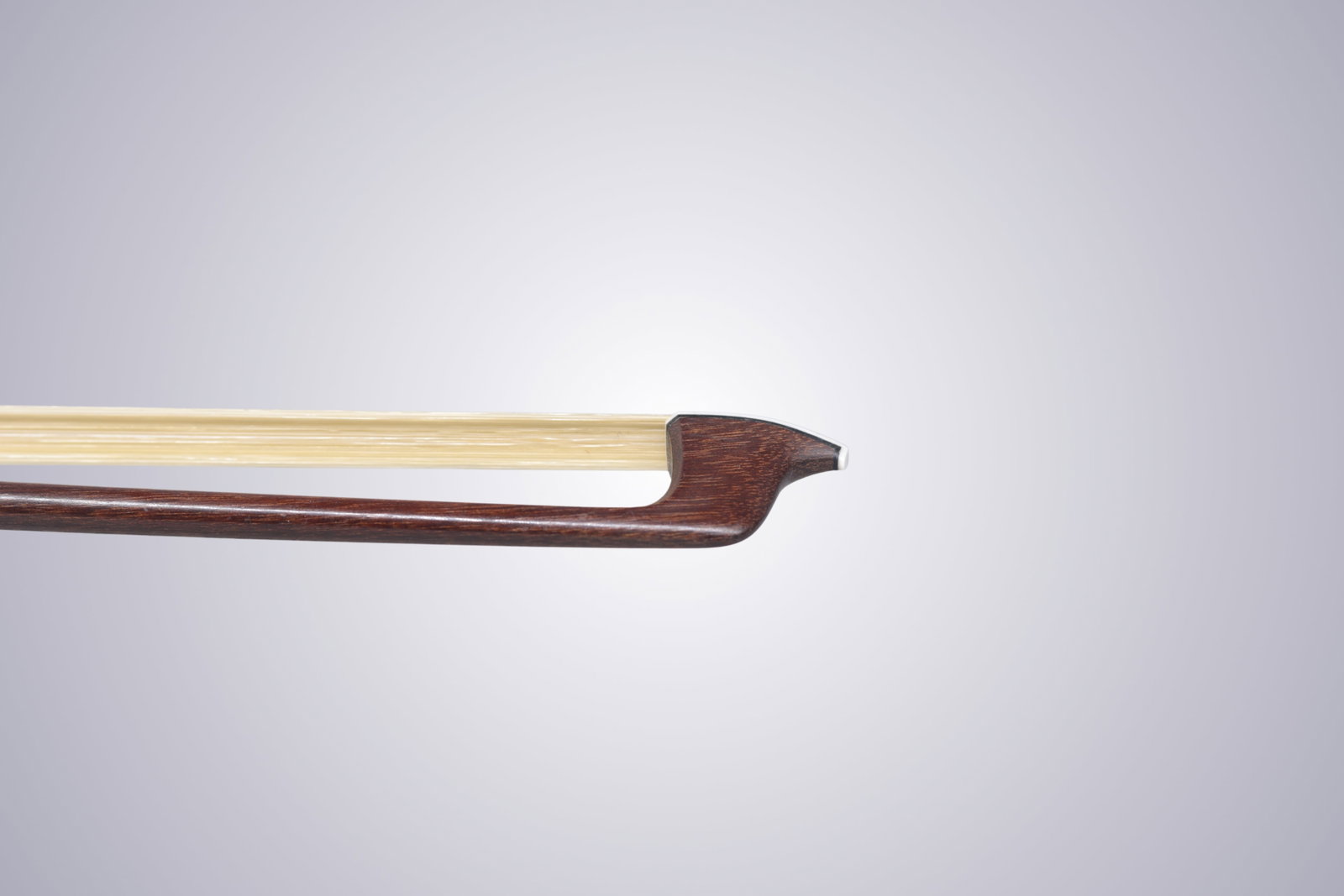 A VIOLIN BOW STAMPED P.C. - 7