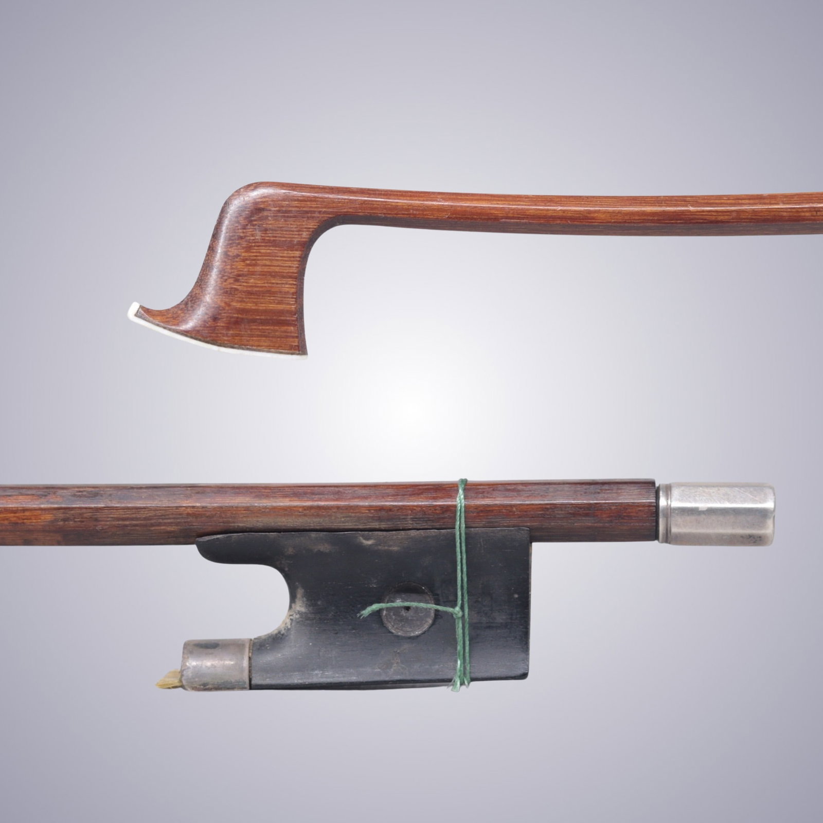 AN INTERESTING SILVER MOUNTED VIOLIN BOW ATTRIBUTED TO BAUSCH WORKSHOP: AN INTERESTING SILVER MOUNTED VIOLIN BOW ATTRIBUTED TO BAUSCH WORKSHOP Of Octagonal Pernambuco Stick, Ebony & Silver mounted. Unstamped. Approximate Dimensions: 74 cm (Total Length - Head to Adjustor)