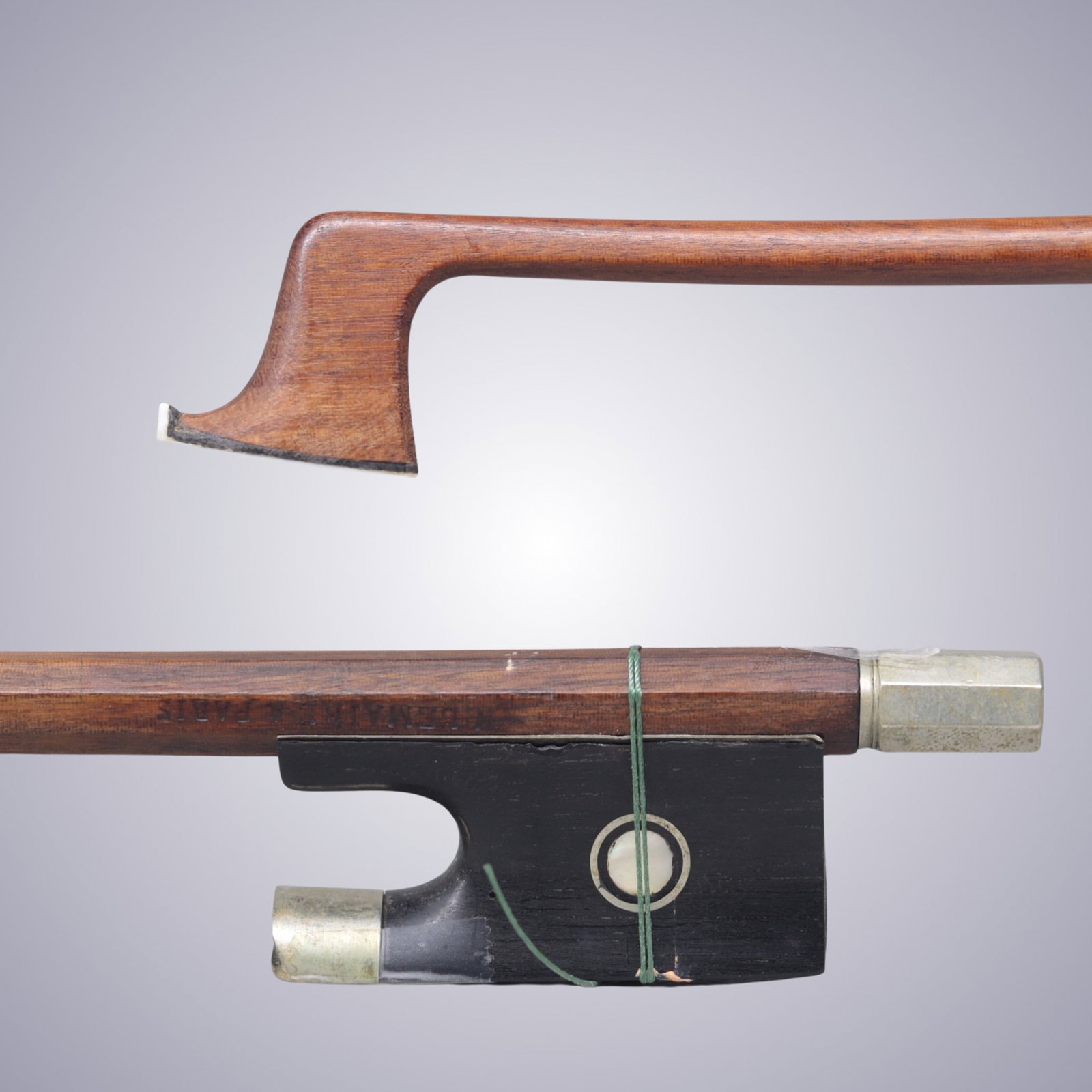 A VIOLIN BOW STAMPED N. LEMAIRE A PARIS ATTRIBUTED TO MORIZOT FRERES: Of Round Pernambuco Stick, Ebony & Maillechort mounted. Stamped on stick above frog: N. LEMAIRE A PARIS Approximate Dimensions: 74.6 cm (Total Length - Head to Adjustor) 48.5 grams in weight