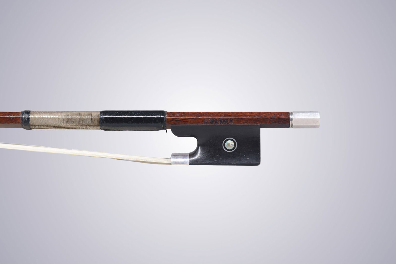 A SILVER MOUNTED VIOLIN BOW STAMPED E. WERNER - 10