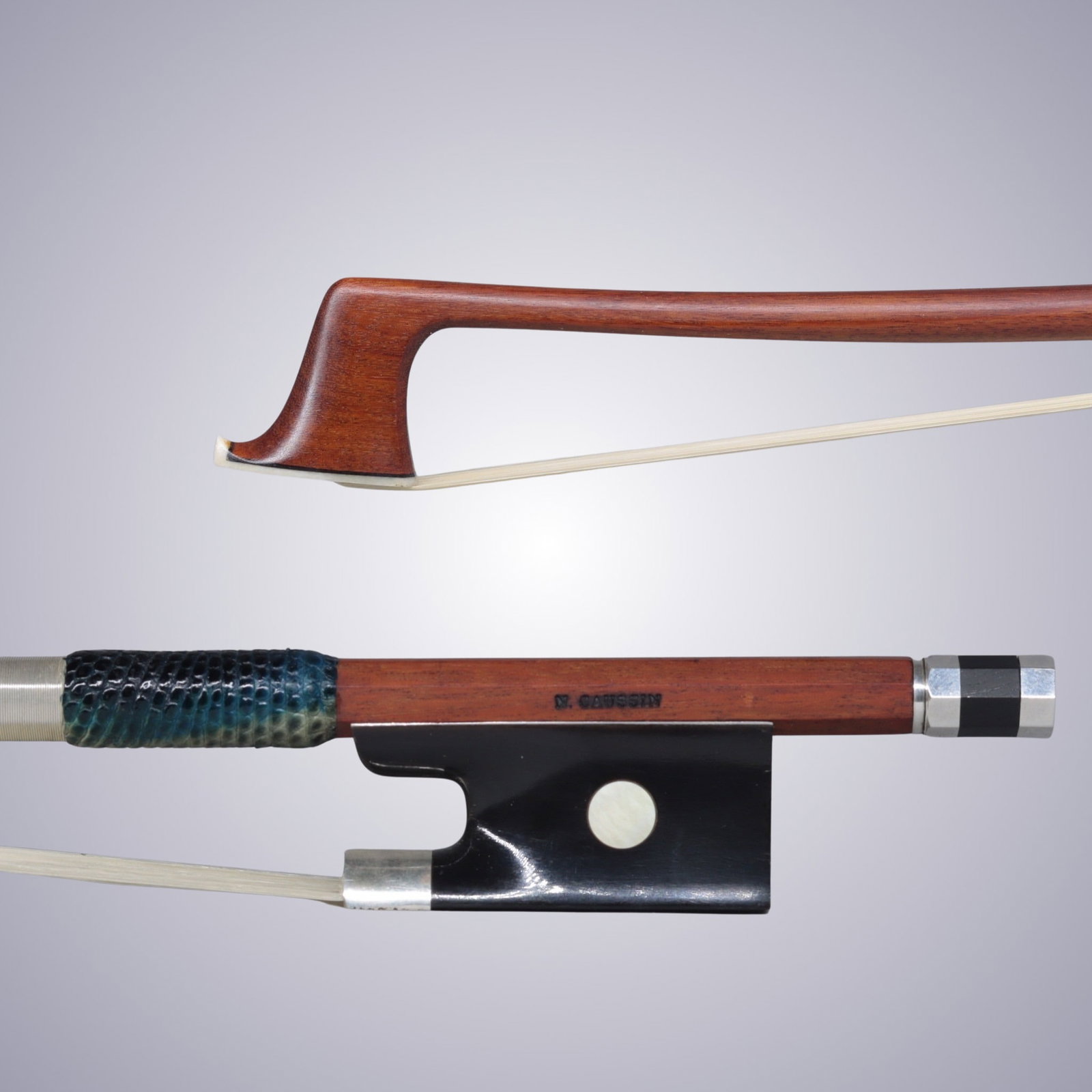 A SILVER & BUFFALO HORN MOUNTED VIOLIN BOW STAMPED N. CAUSSIN: A SILVER & BUFFALO HORN MOUNTED VIOLIN BOW STAMPED N. CAUSSIN Of Round Pernambuco Stick, Buffalo Horn & Silver mounted. Stamped on stick above frog: N. CAUSSIN Approximate Dimensions: 74.5 cm (Total L