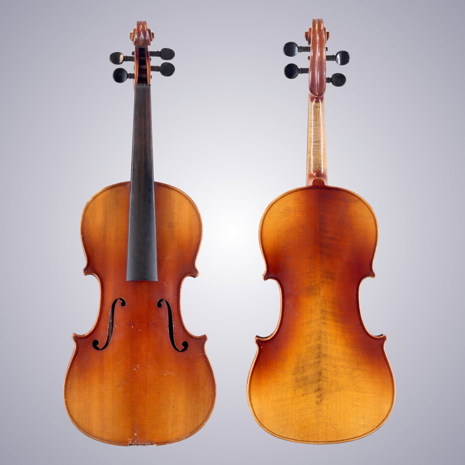 A GERMAN VIOLIN LABELED COPY OF ANTONIUS STRADIVARIUS: A GERMAN VIOLIN LABELED COPY OF ANTONIUS STRADIVARIUS The back is of two-piece maple, quarter-cut joined at the center and with flames descending from center to bouts. The ribs and scroll are of
