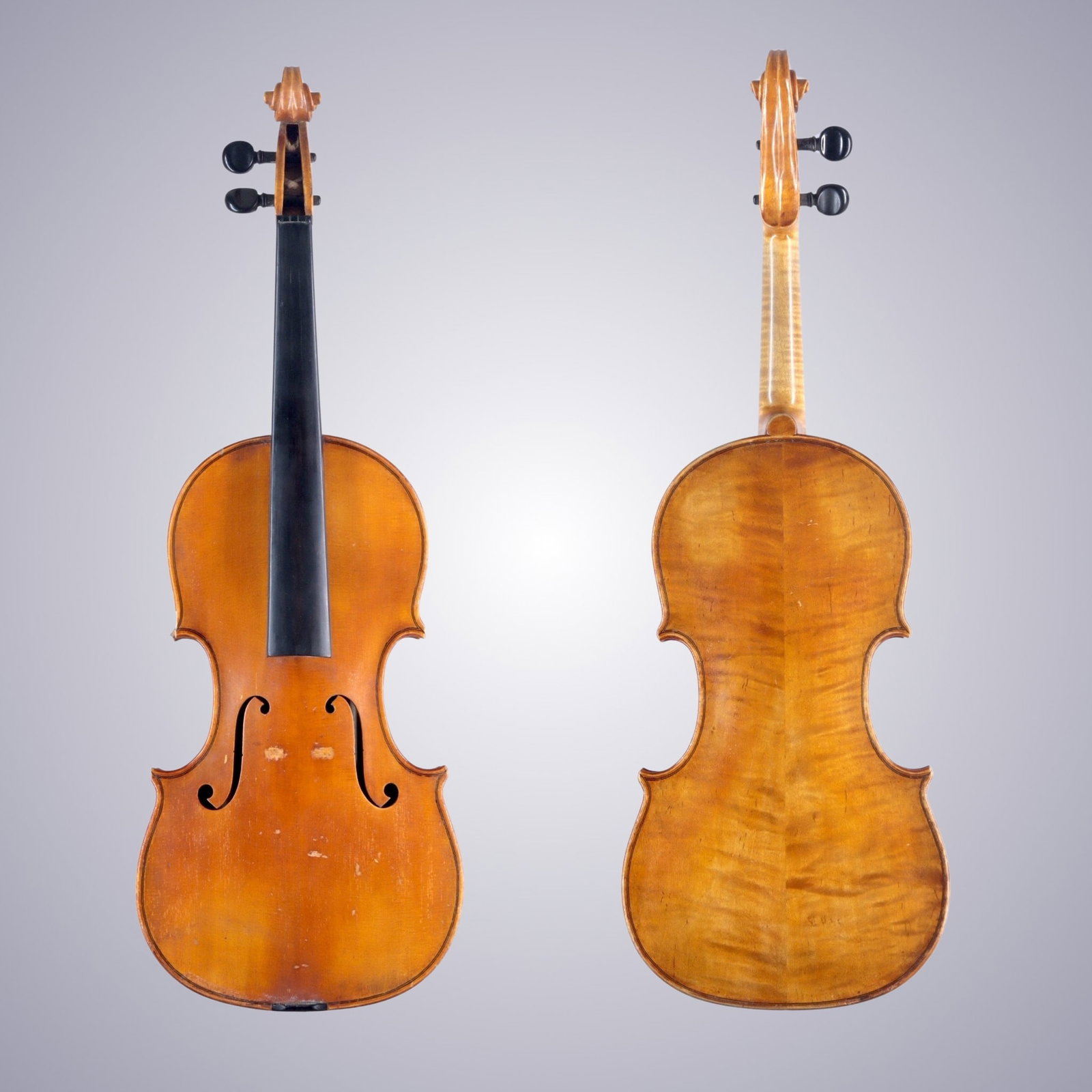 A VIOLIN LABELED GEO A. OSTERTAG: A VIOLIN LABELED GEO A. OSTERTAG The back is of two-piece maple, quarter-cut joined at the center with flames ascending from center to bouts. The ribs and scroll are of similar wood. The top is of