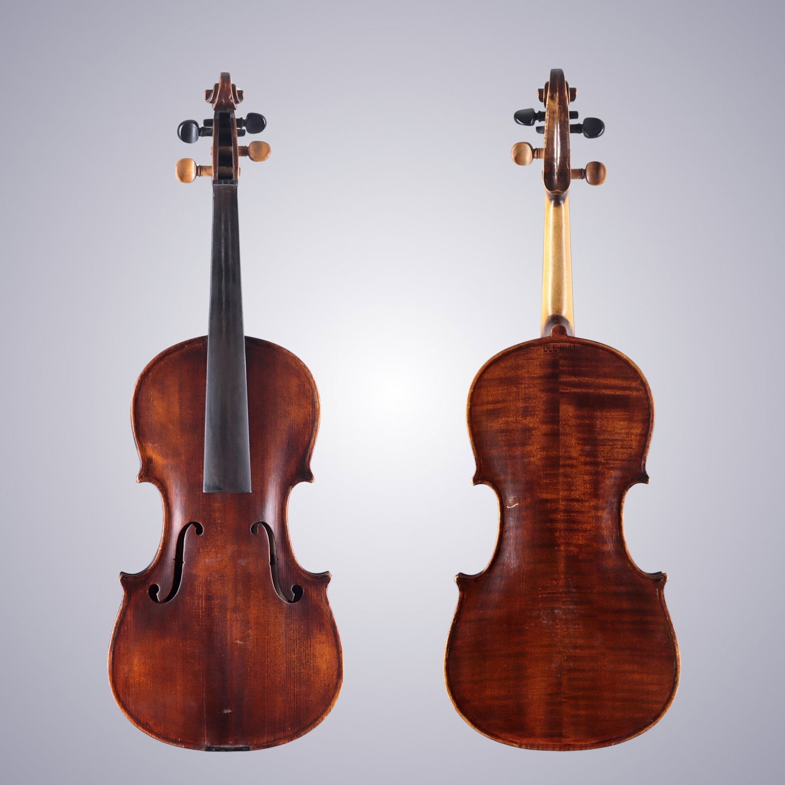 A 19TH CENTURY GERMAN-STYLE 'OLE-BULL' MODEL VIOLIN RESTORED 1974: A 19TH CENTURY GERMAN-STYLE 'OLE-BULL' MODEL VIOLIN REPAIRED 1974 The back is of two-piece maple, quarter-cut joined at the center and with flames running horizontally from center. The ribs are of