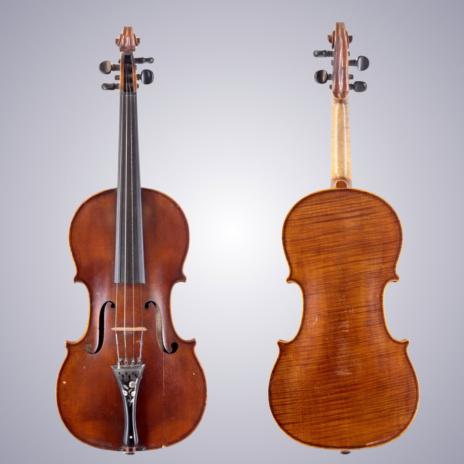A VIOLIN BRANDED AND LABELED NICOLAS BERTHOLINI: A VIOLIN BRANDED AND LABELED NICOLAS BERTHOLINI The back is of One-piece maple densely flamed with flames descending from right to left. The ribs and scroll are of similar wood. The top is of