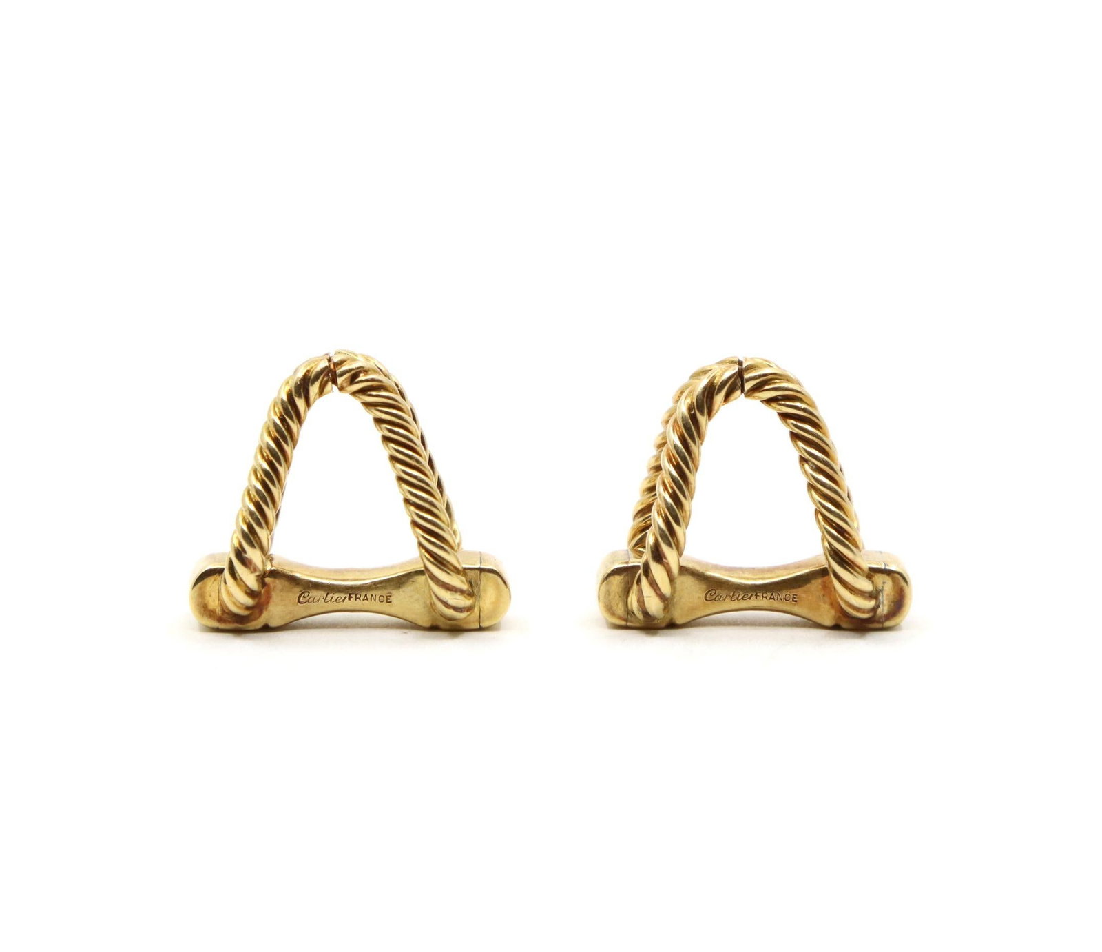 CARTIER 18K GOLD CUFFLINKS: CARTIER 18K GOLD CUFFLINKS Designed as a pair of 18K yellow gold cufflinks featuring twisted rope-form arched links joined by polished cylindrical terminals. Approximate Dimensions: 2 cm (Length) 1.2 