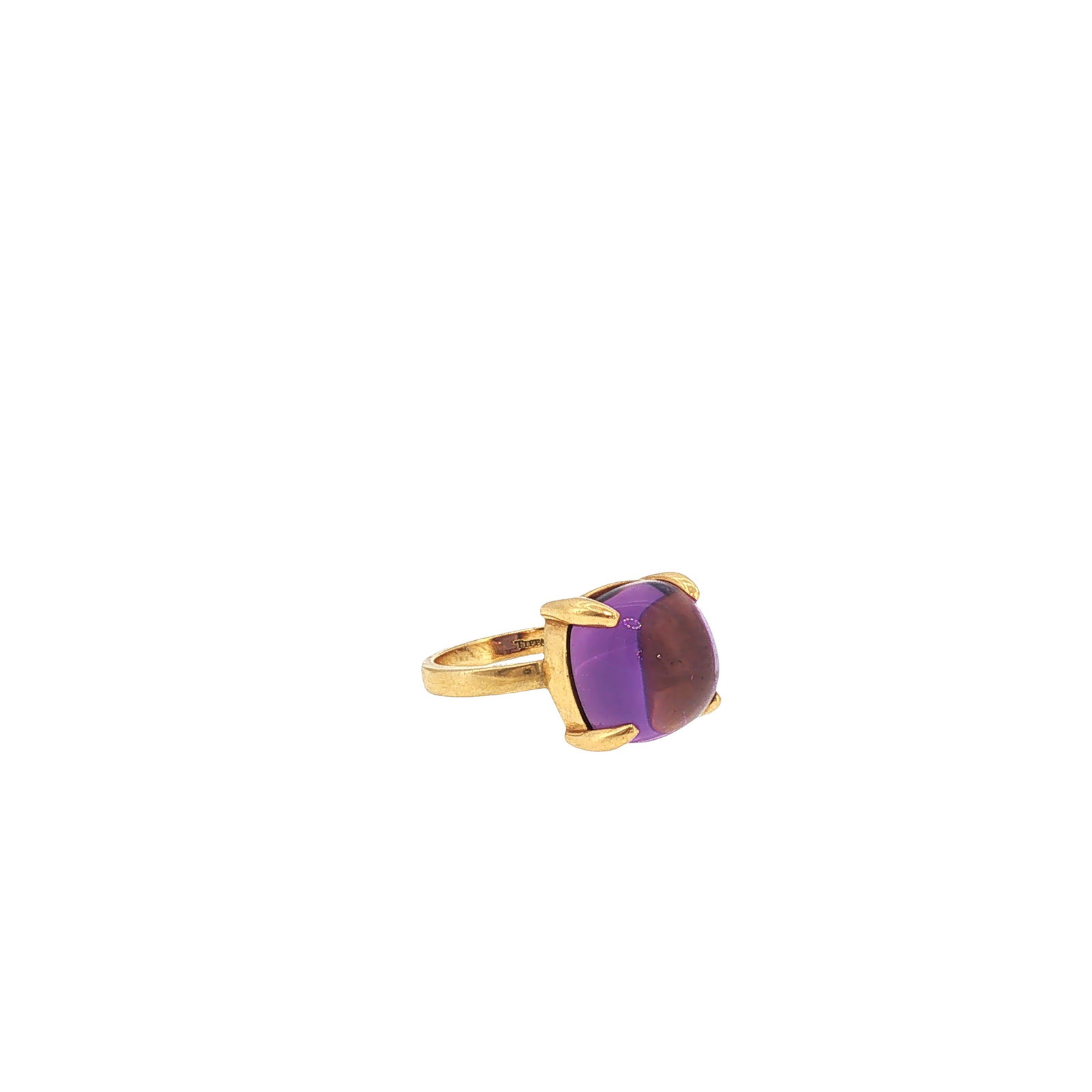 TIFFANY & CO. "SUGAR STACKS" 18K GOLD AMETHYST CABOCHON RING: TIFFANY & CO. "SUGAR STACKS" 18K GOLD AMETHYST CABOCHON RING Designed by Elsa Peretti, centering a cushion-shaped cabochon amethyst in an 18K yellow gold four-prong mount. Signed Tiffany & Co. Approxi