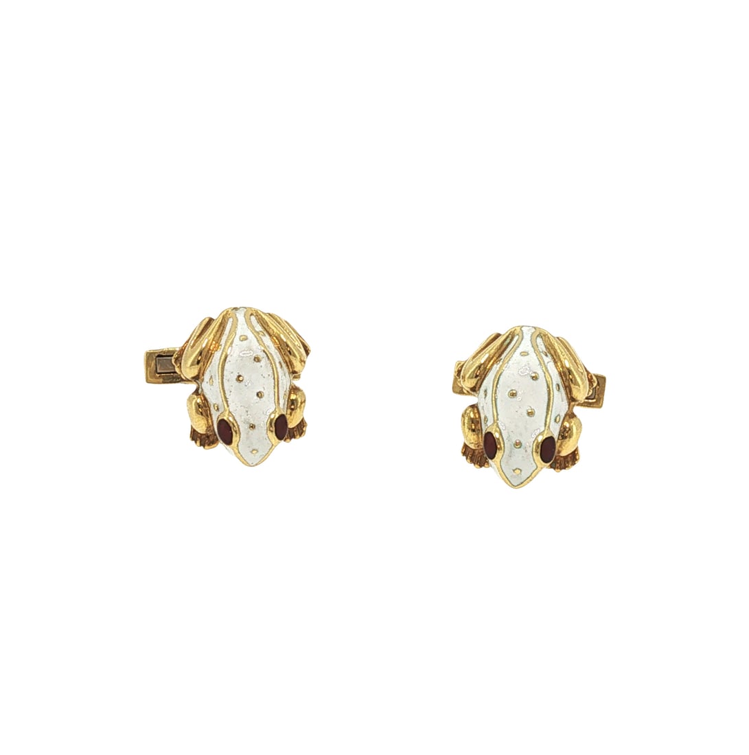 DAVID WEBB 18K GOLD ENAMEL FROG CUFFLINKS: DAVID WEBB 18K GOLD ENAMEL FROG CUFFLINKS Designed as stylized frogs decorated with white enamel and cabochon ruby eyes, with swivel bar backs. Signed David Webb. Approximate Dimensions: 1.76 cm (Leng
