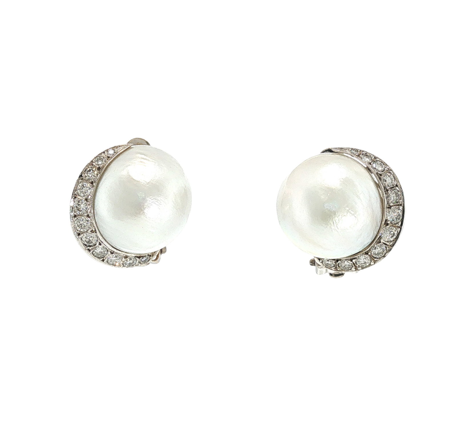 SEAMAN SCHEPPS 14K WHITE GOLD PEARL AND DIAMOND EAR CLIPS: SEAMAN SCHEPPS 14K WHITE GOLD PEARL AND DIAMOND EAR CLIPS Each centering a large cultured pearl accented by a crescent of round brilliant-cut diamonds, mounted in 14K white gold, signed Seaman Schepps
