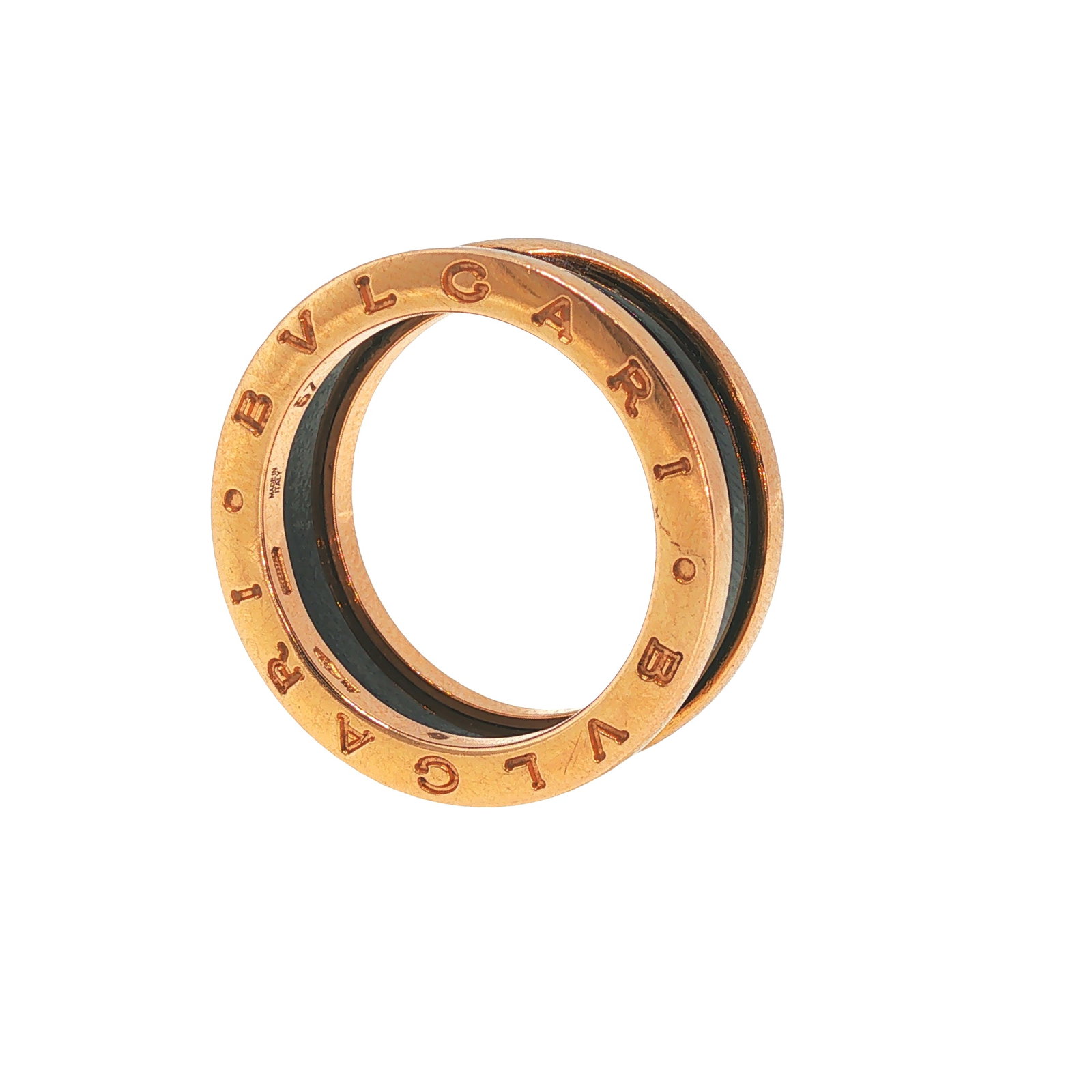BULGARI 18K GOLD CERAMIC B.ZERO1 RING: BULGARI 18K GOLD CERAMIC B.ZERO1 RING A Bulgari B.ZERO1 ring crafted in 18 karat rose gold with a black ceramic center band. The iconic design features engraved "BVLGARI" lettering to either side, ins