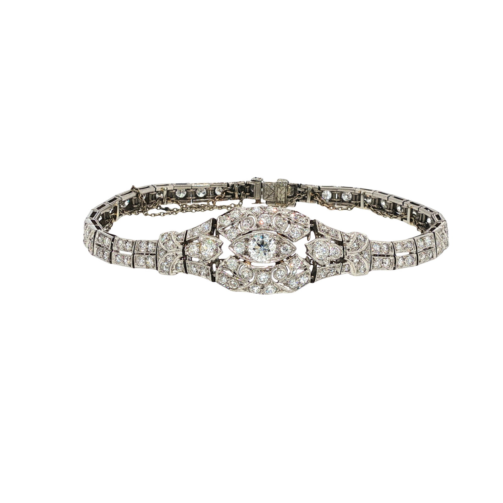 ART DECO PLATINUM AND DIAMOND BRACELET: ART DECO PLATINUM AND DIAMOND BRACELET An Art Deco platinum bracelet of openwork geometric design, set throughout with old European and single-cut diamonds in finely pierced and millegrain-decorated m