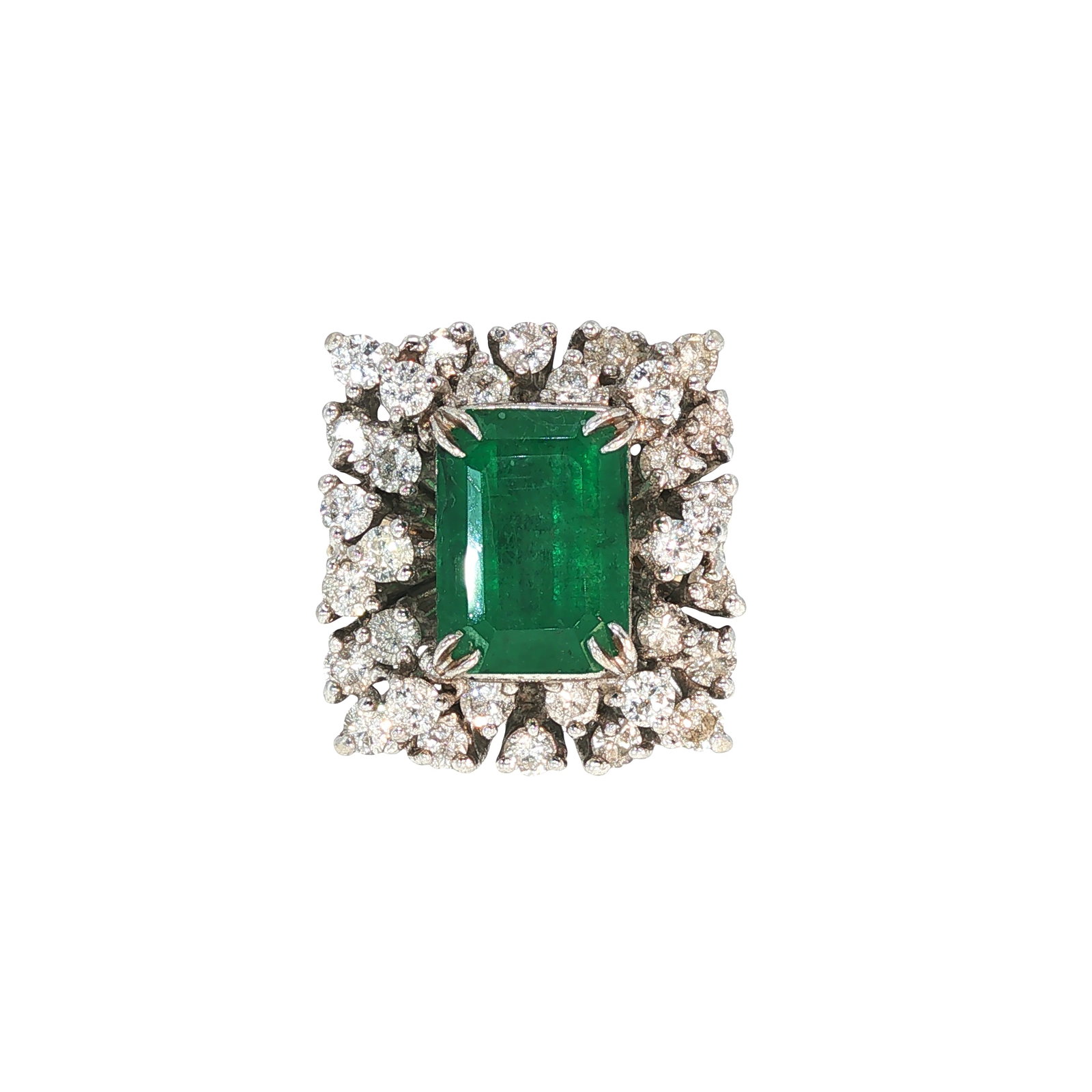 14K GOLD EMERALD AND DIAMOND RING: 14K GOLD EMERALD AND DIAMOND RING A 14K gold ring centered by a rectangular emerald-cut emerald, framed by a double halo of round brilliant-cut diamonds. The substantial cluster setting enhances the