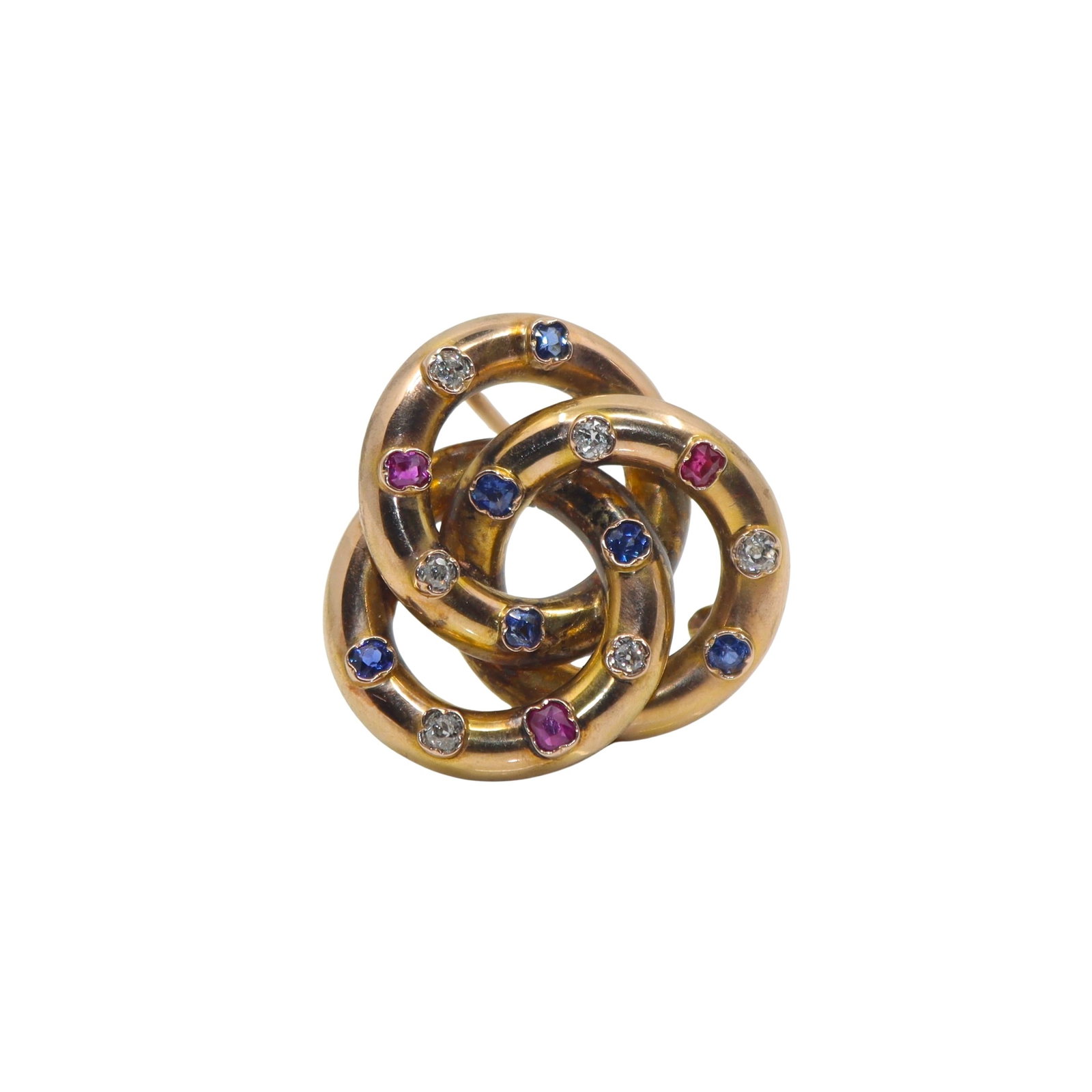 VICTORIAN 14K GOLD RUBY SAPPHIRE AND DIAMOND TRINITY KNOT BROOCH: VICTORIAN 14K GOLD RUBY, SAPPHIRE AND DIAMOND TRINITY KNOT BROOCH A Victorian 14 karat yellow gold brooch designed as three interlocking circles forming a trinity knot motif, symbolizing eternity and 