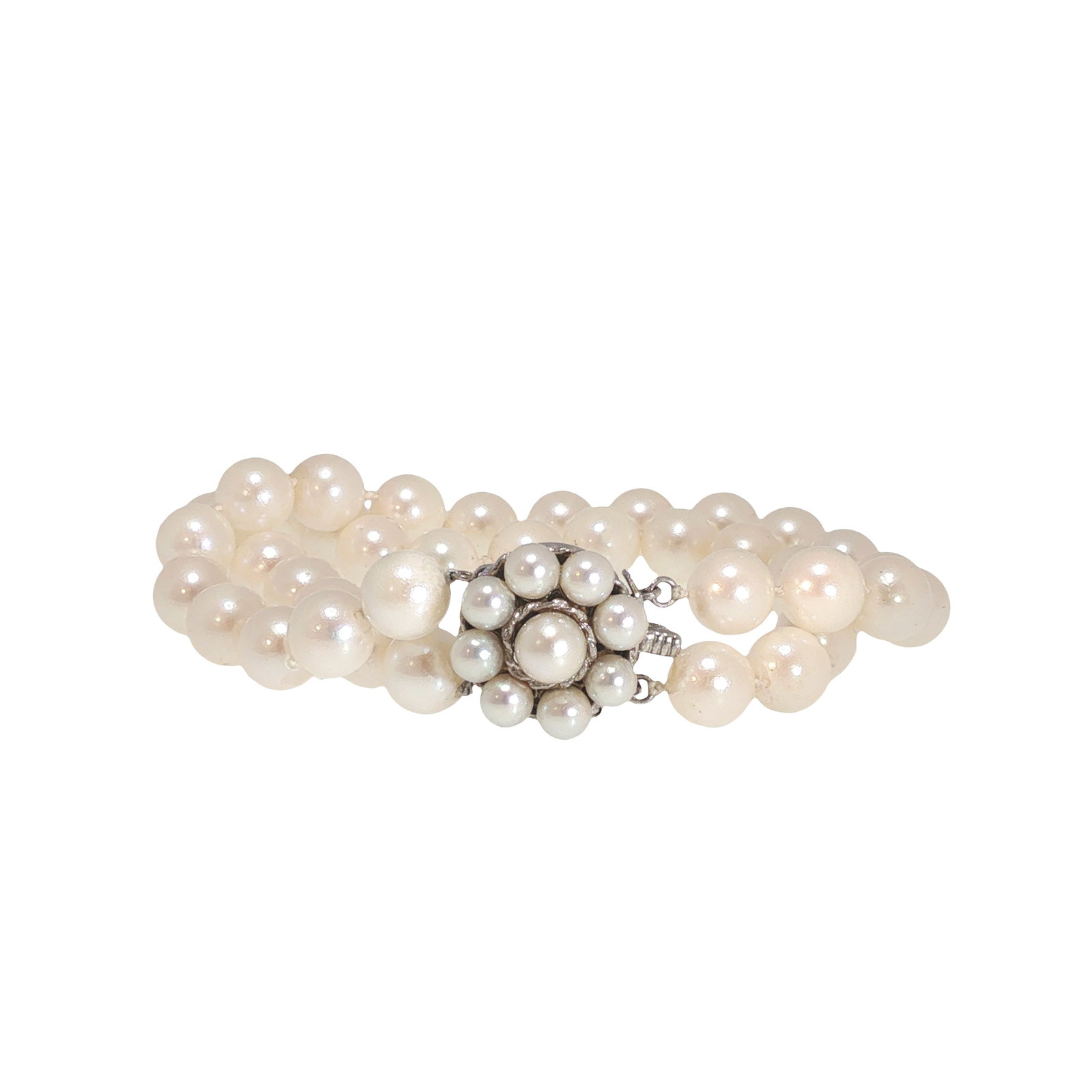 14K WHITE GOLD PEARL BEAD BRACELET: 14K WHITE GOLD PEARL BEAD BRACELET Composed of multiple strands of pearl beads, joined by a 14K white gold clasp designed as a clustered pearl motif. The bracelet displays a soft white to cream luster