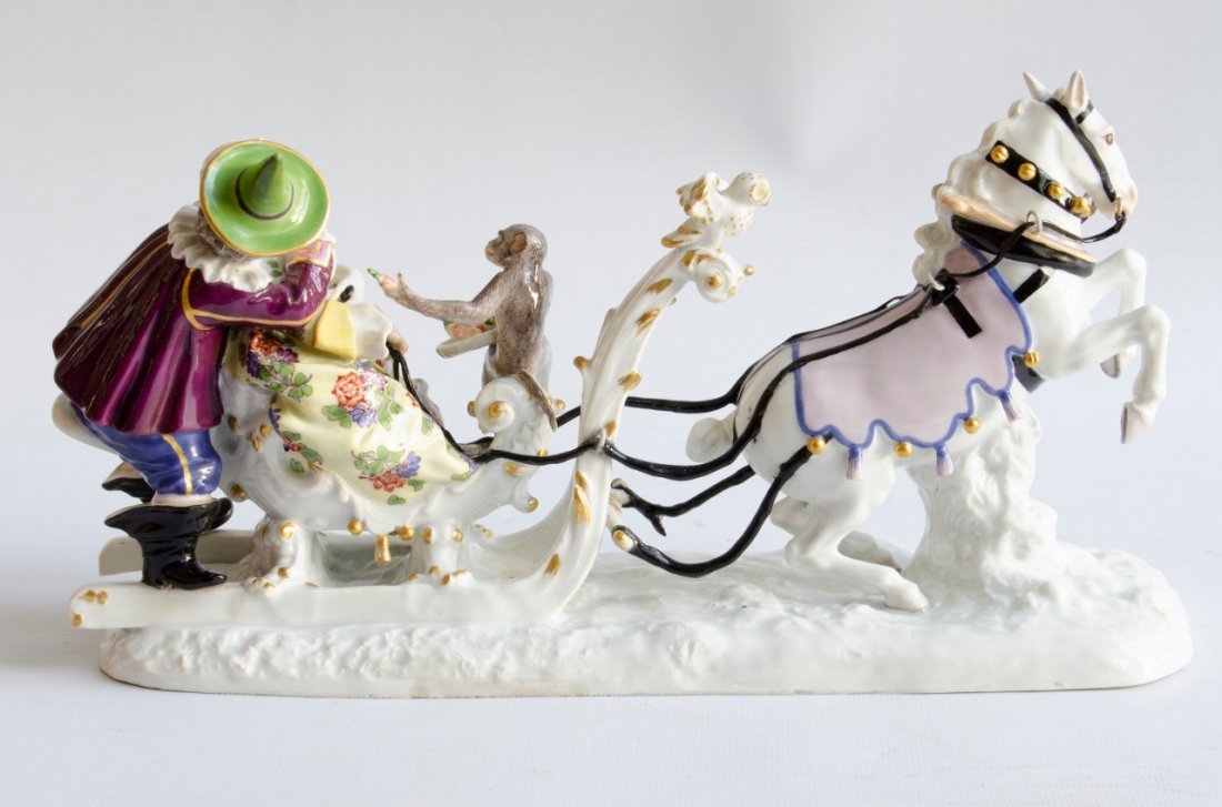 A MEISSEN PORCELAIN SLEDDING GROUP OF FRÖHLICH: A MEISSEN PORCELAIN SLEDDING GROUP OF FRÖHLICH AND A COURTESAN. SIZE height 6in (15cm); length 11 3/4in (30cm)