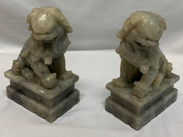 Pair of Soapstone Foo Dog Bookends: Pair of Soapstone Foo Dog Bookends Mouths Open Some small nicks Aprox Size 7" H x 4 1/2" W x 3" D Photo's are considered a part of the