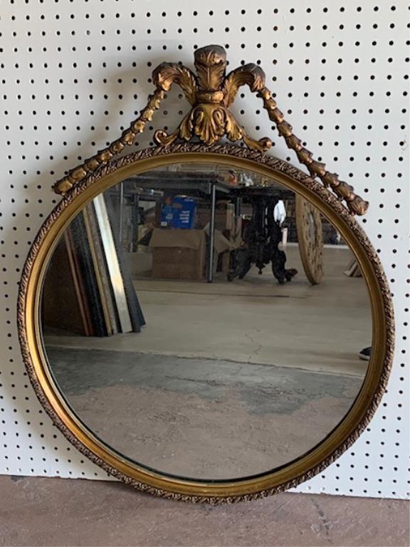 Round Antique Wood Carved Mirror: Round Antique Wood Carved Mirror. Gold Frame. Aprox Size 26" W x 32" H. Some aging on Mirror.