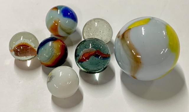 7 Larger Assorted Marbles: 7 Larger Assorted Marbles. Photo's are considered a part of the description and condition.