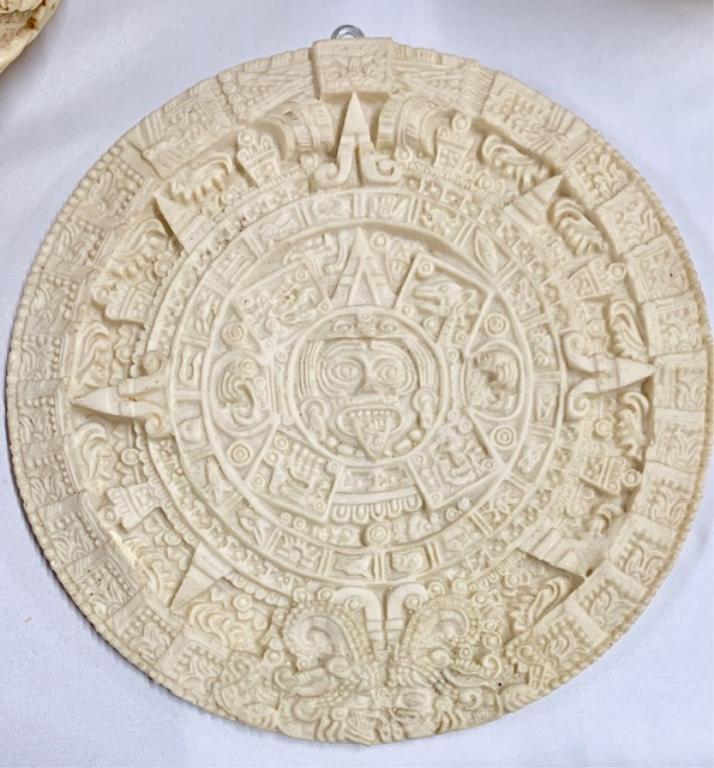Heavily Carved Ivory Look Mayan Calendar Plaque: Heavily Carved Ivory Look Composite Mayan Calendar Plaque. Artesanias Finas "Yagul". Apx. 10" Diameter. Photo's are considered a part of the