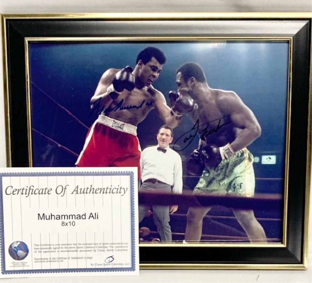 Muhammad Ali & George Foreman Signed Photo: Muhammad Ali and George Foreman signed 8"x10" in frame with certificate of authenticity. Photos are considered part of the description and condition.