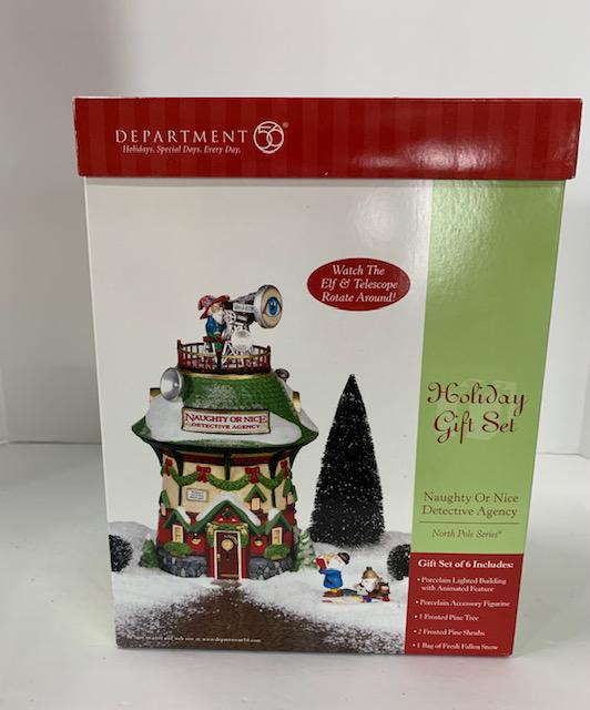 Dept 56 "Naughty or Nice Detective Angency": North Pole Series. "Naughty or Nice Detective Agency". Man Holding Book has been re-glued. Photo's are considered part of the description and condition.