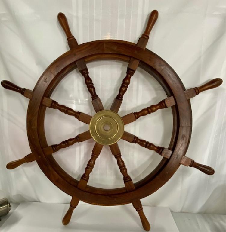 Wood/Brass Decorator Ship's Wheel: Wood/Brass Decorator Ship's Wheel. Apx. 34" Diameter. Pictures are considered part of the description and condition.