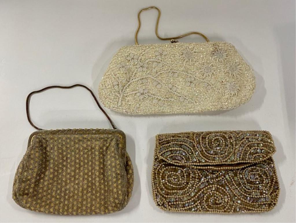 3 Vintage Beaded Purses: 3 Vintage beaded purses/clutches. White one marked: Hand beaded in Hong Kong. Zipper top - Made in Japan. Snap on front - Sak's Fith Avenue Photos are considered part of the description